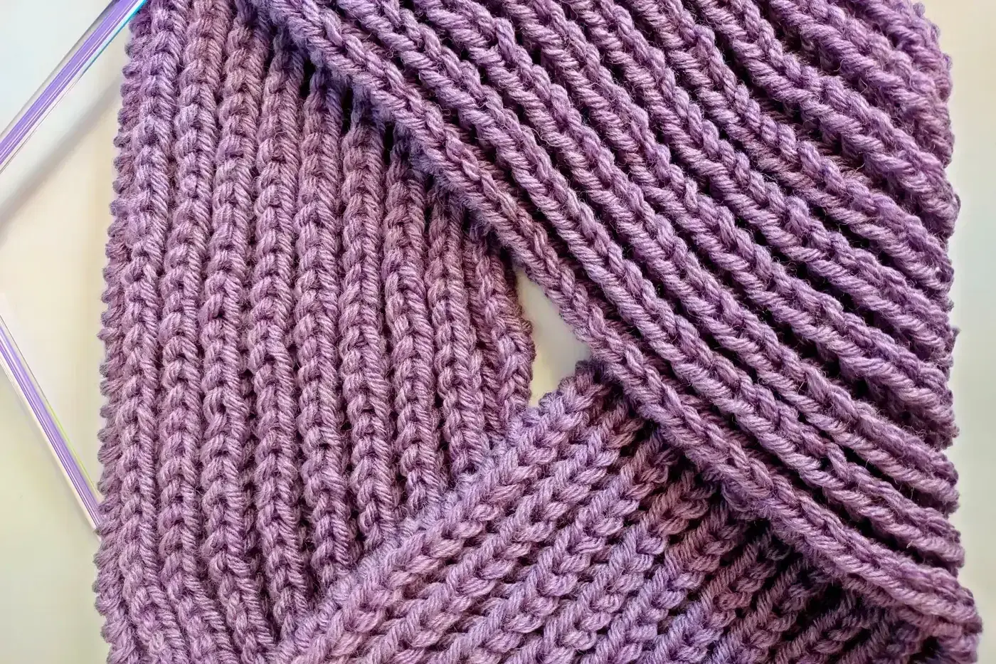 Close-up of ribbed knitted fabric showing alternating raised and recessed columns