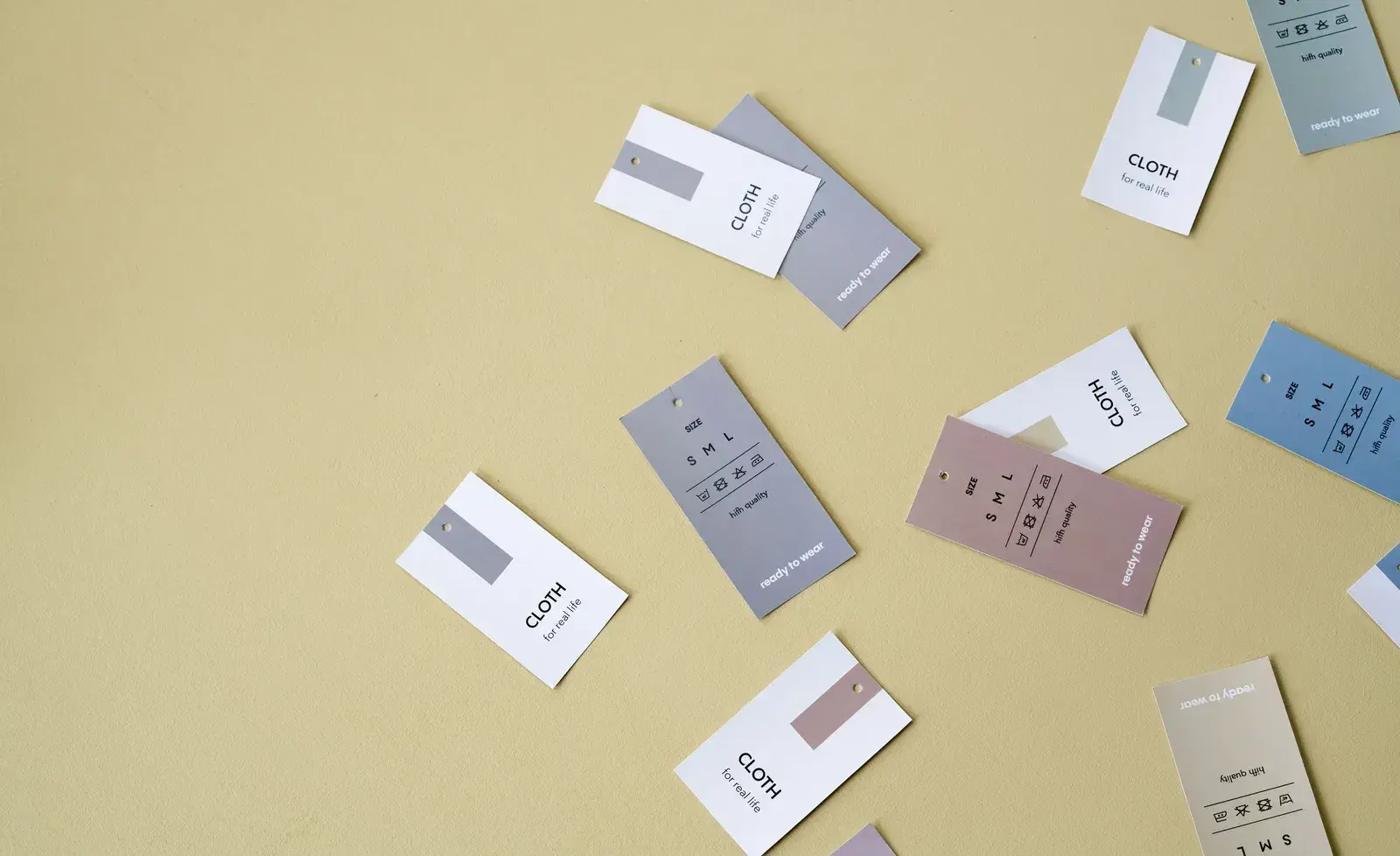 Assorted clothing tags showing that product quantities must be defined by a specific configuration