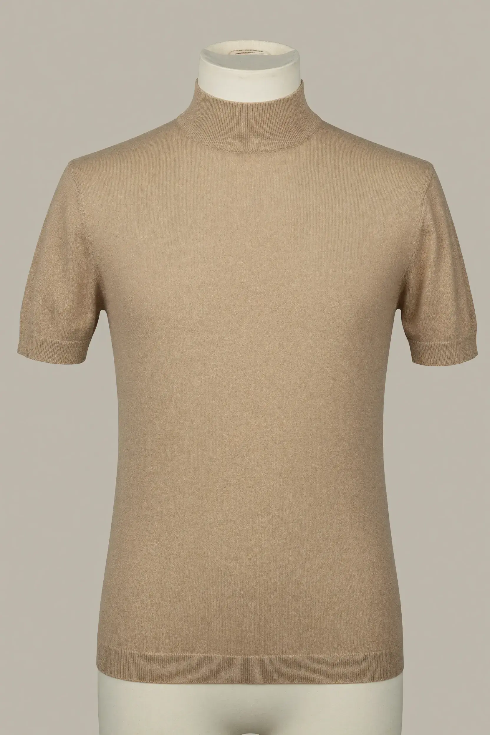 Camel slim short-sleeve mock-neck knit top shown on a torso mannequin for private-label fashion development