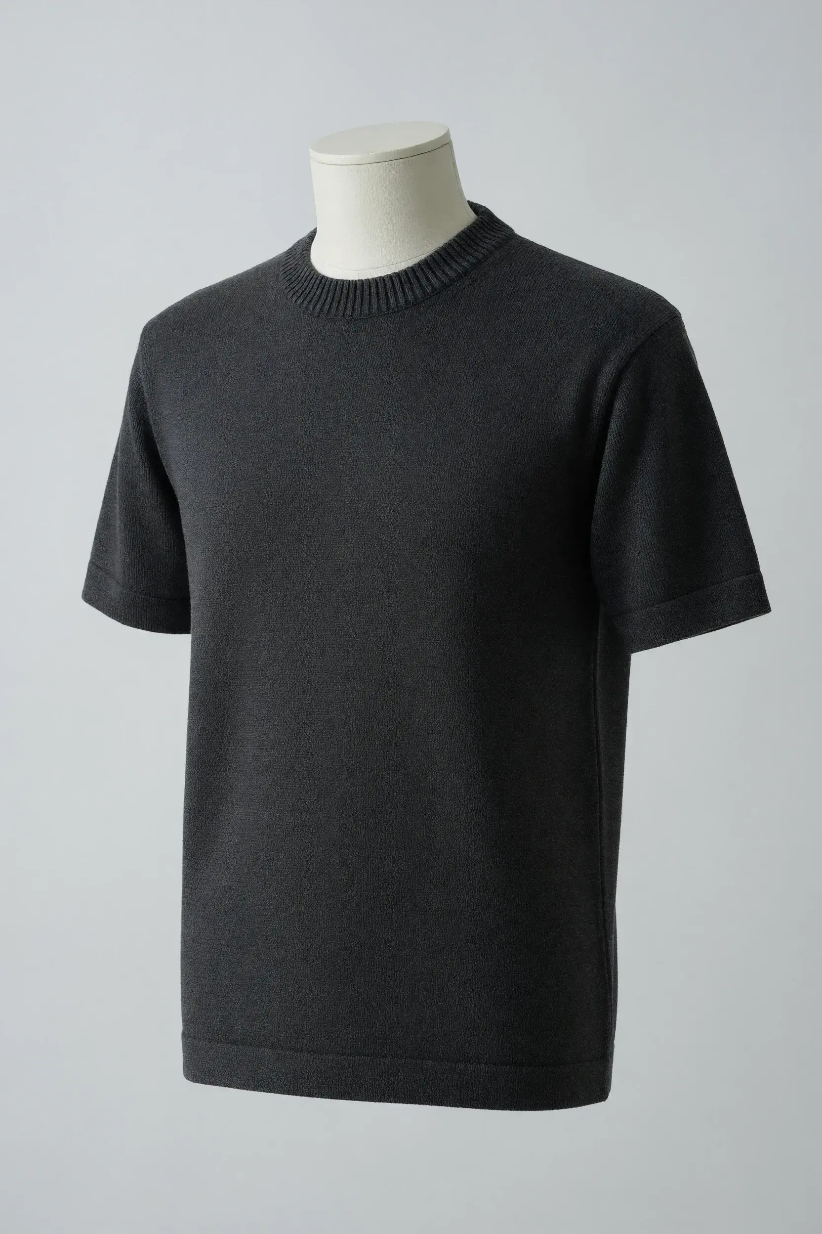 Charcoal crew-neck short-sleeve knit tee with narrow ribbed neck and cuffs and a straight hem on a faceless torso mannequin for private-label development