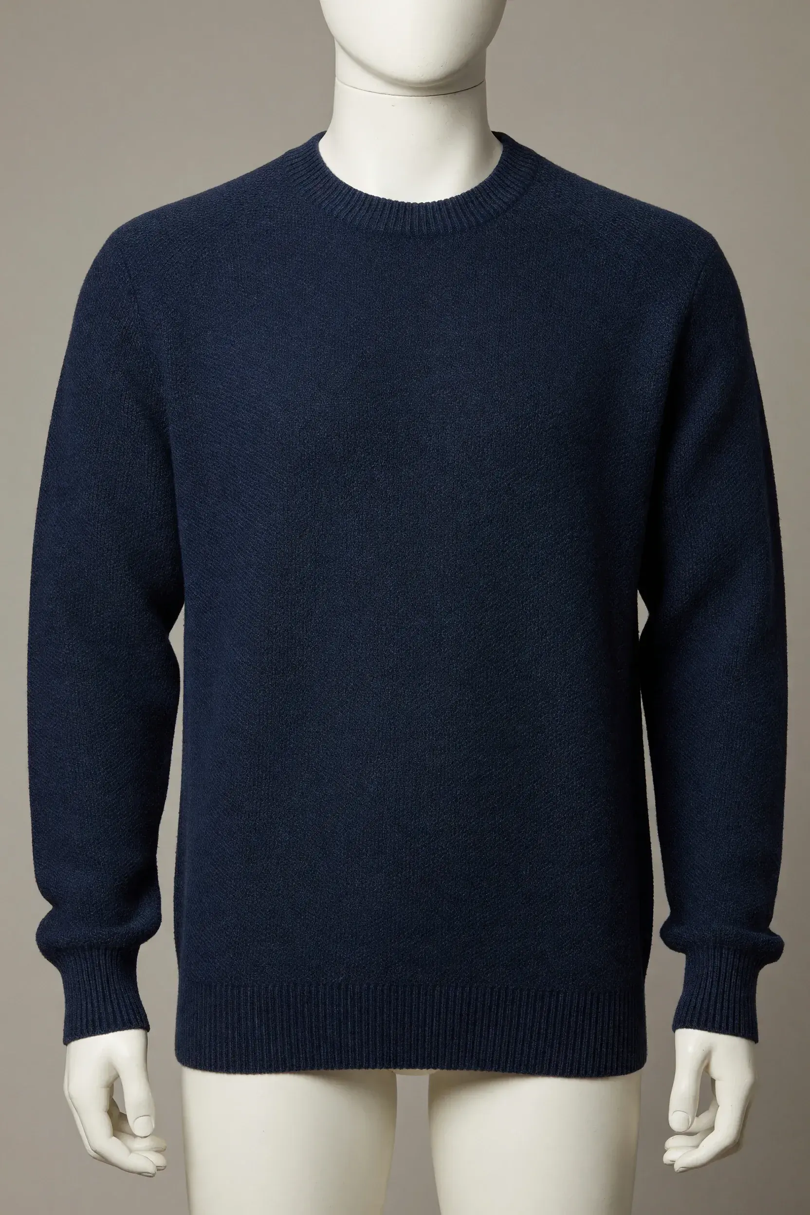 Navy long-sleeve crewneck sweater with deep rib cuffs and hem shown on a mannequin for private-label development