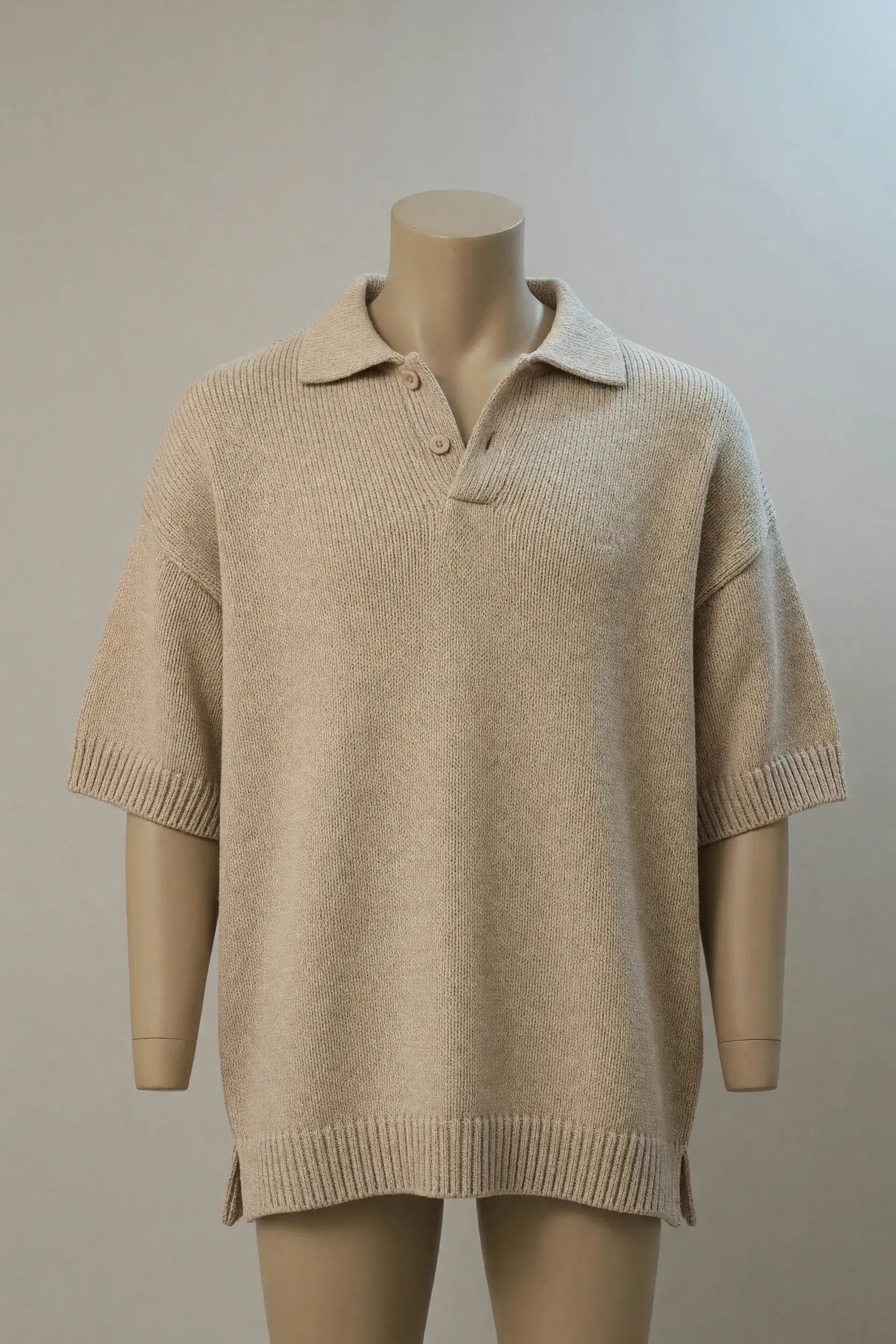 Sand relaxed open-collar short-sleeve knit polo presented on a torso mannequin for private-label collection development