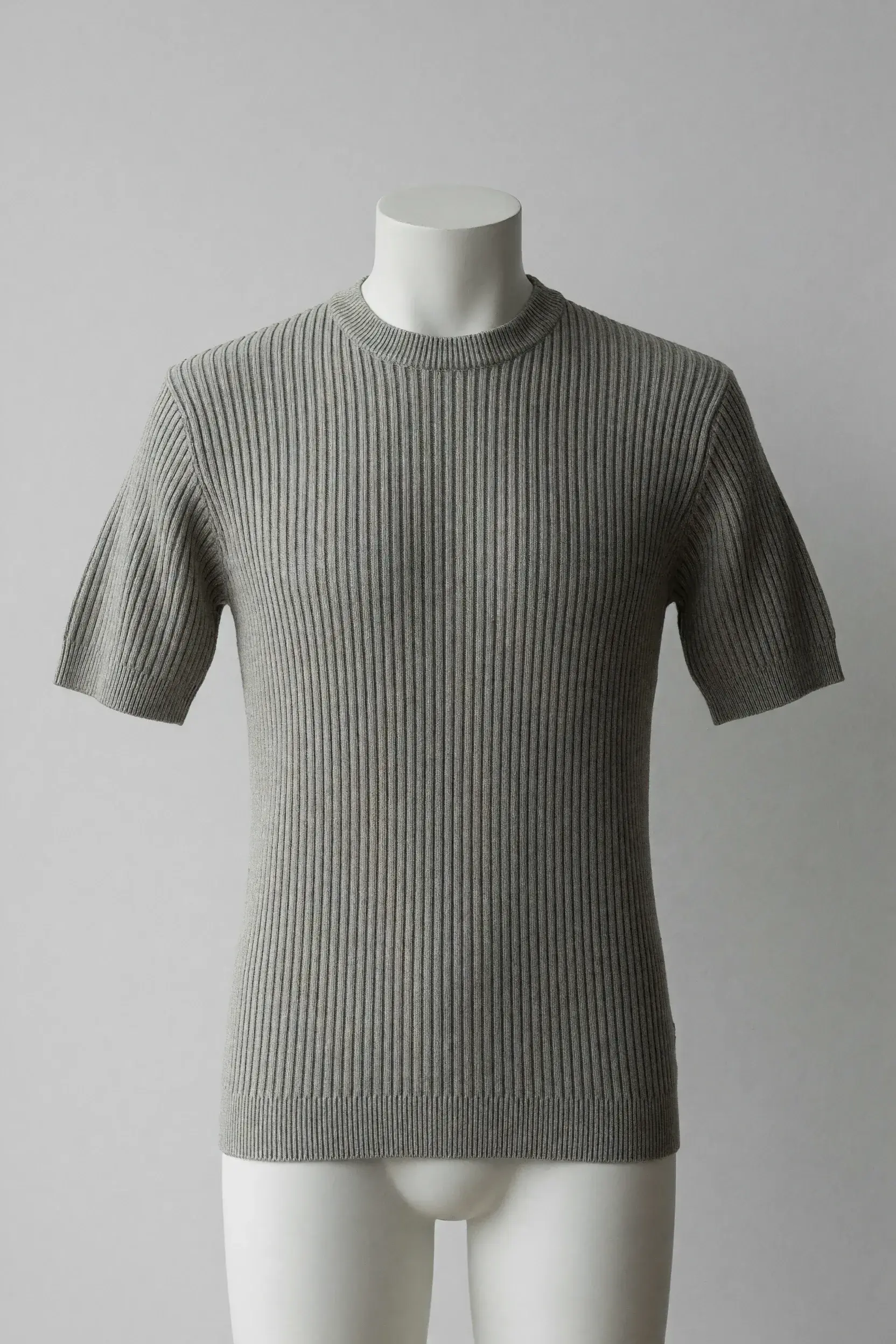 Light silver-grey vertical-rib crewneck short-sleeve knit tee on a mannequin for private-label product development