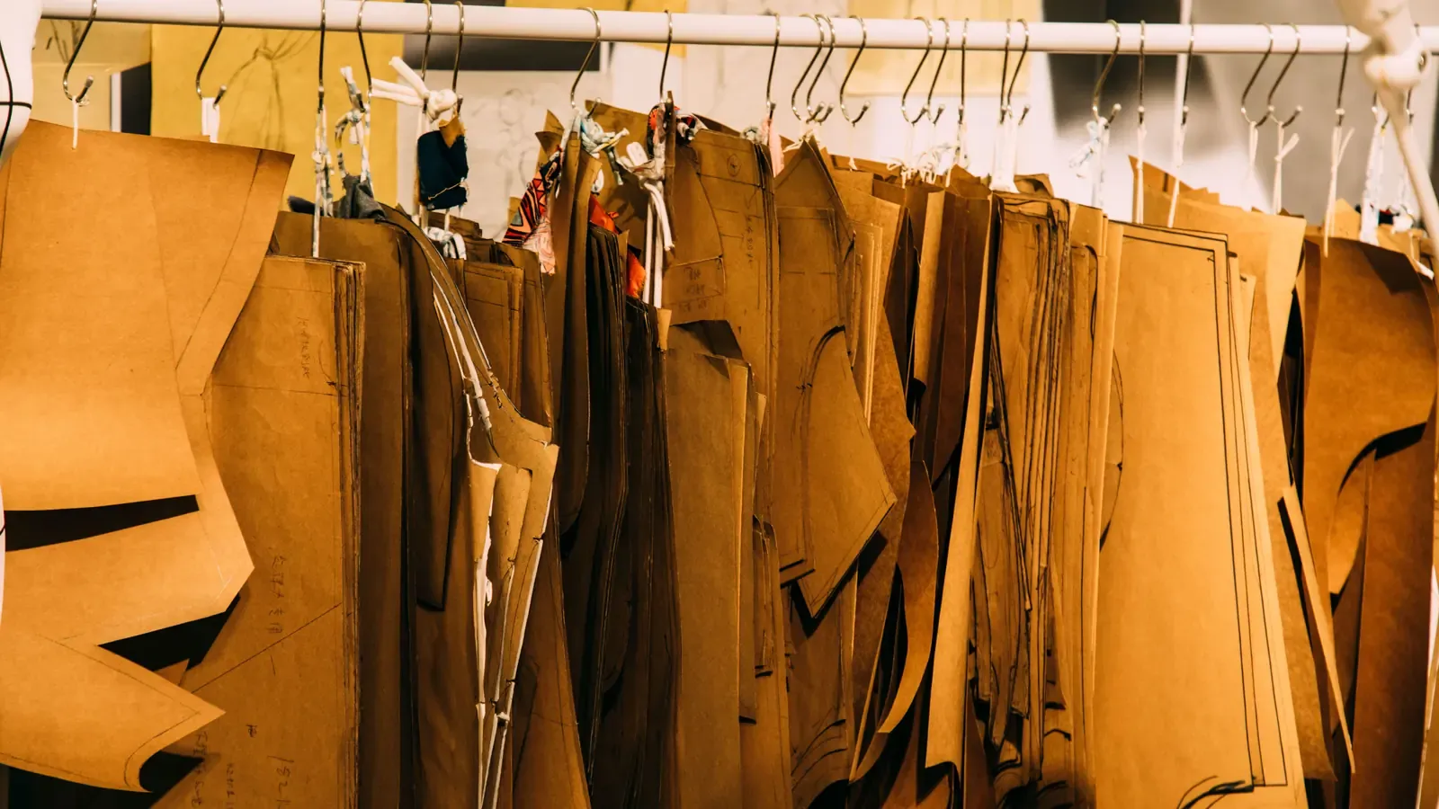 Rows of paper garment patterns organized for different pieces and sizes