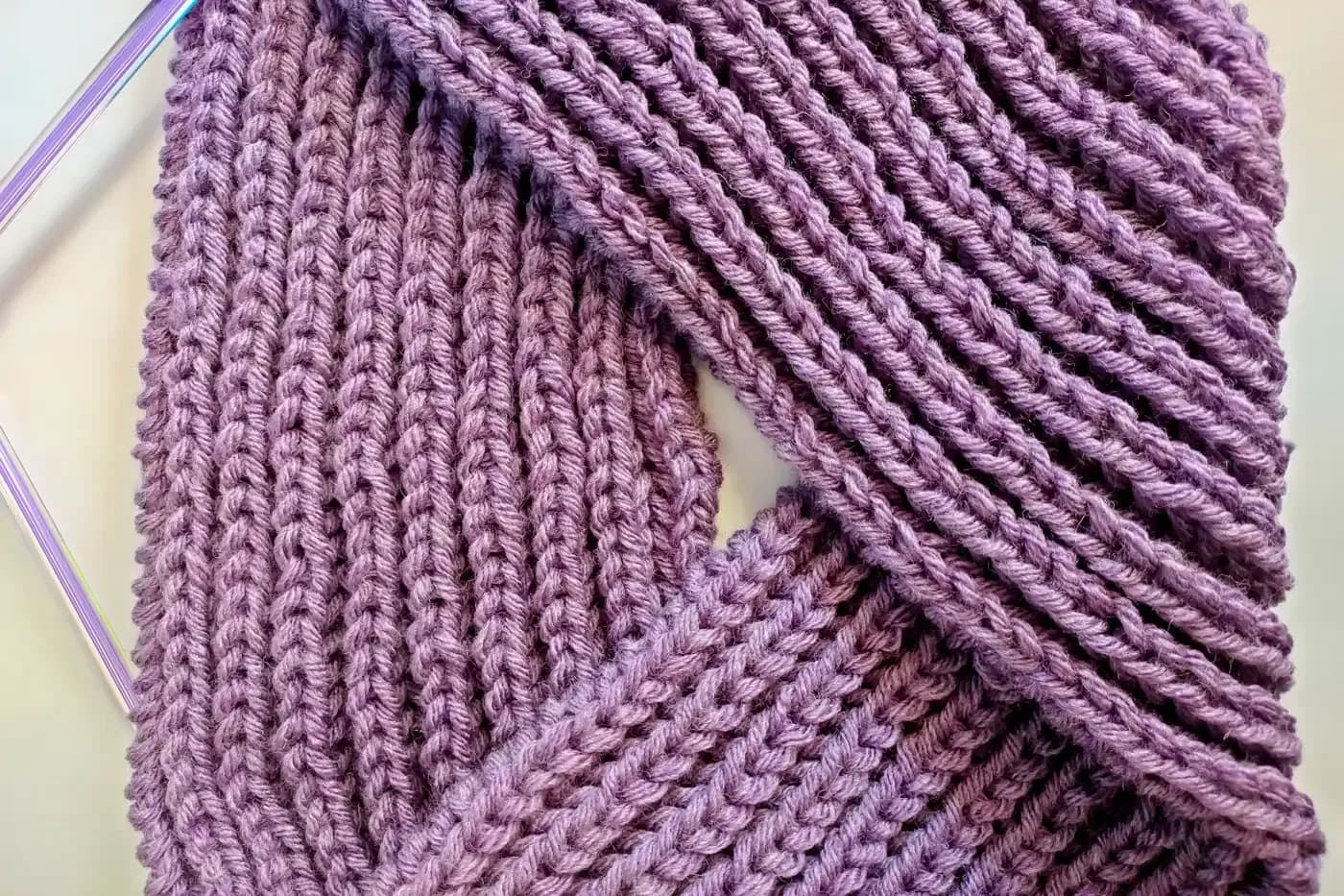 Close-up of ribbed knitted fabric showing alternating raised and recessed columns