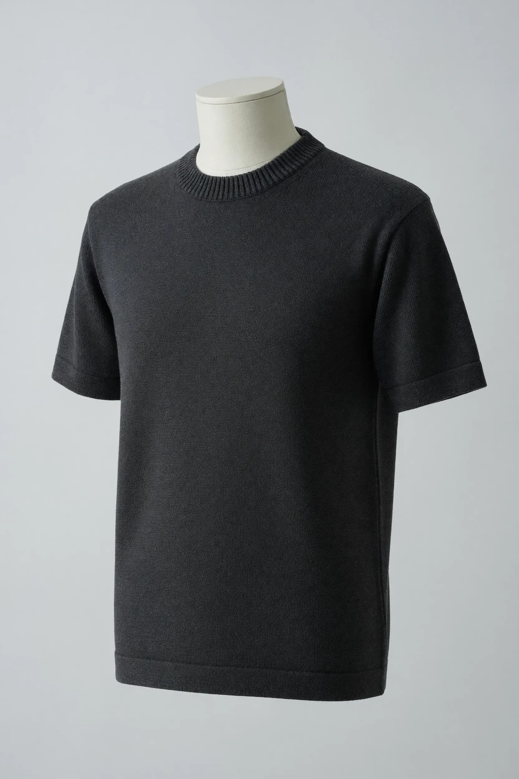 Charcoal crew-neck short-sleeve knit tee with narrow ribbed neck and cuffs and a straight hem on a faceless torso mannequin for private-label development