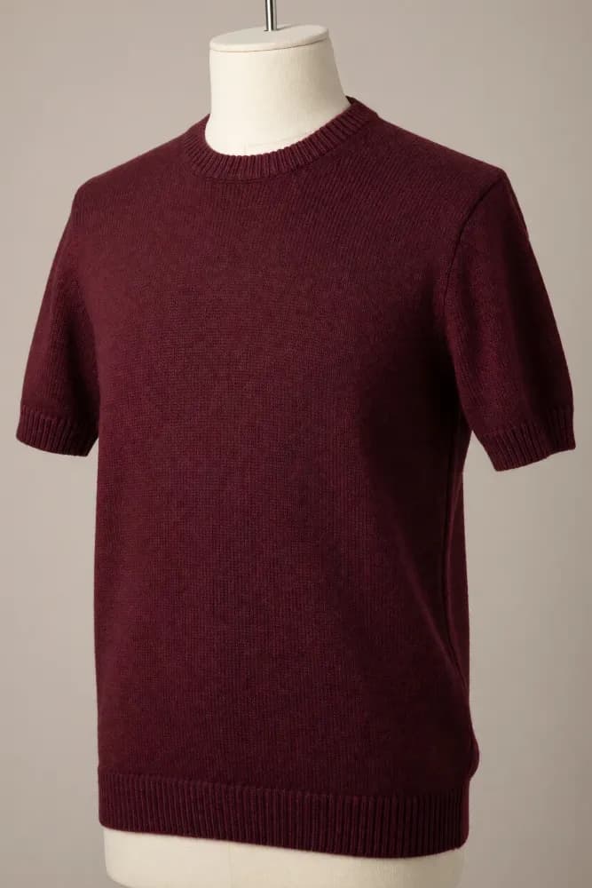 Burgundy crew-neck short-sleeve knit tee with prominent ribbing at the collar, cuffs and hem displayed on a torso mannequin for private-label production