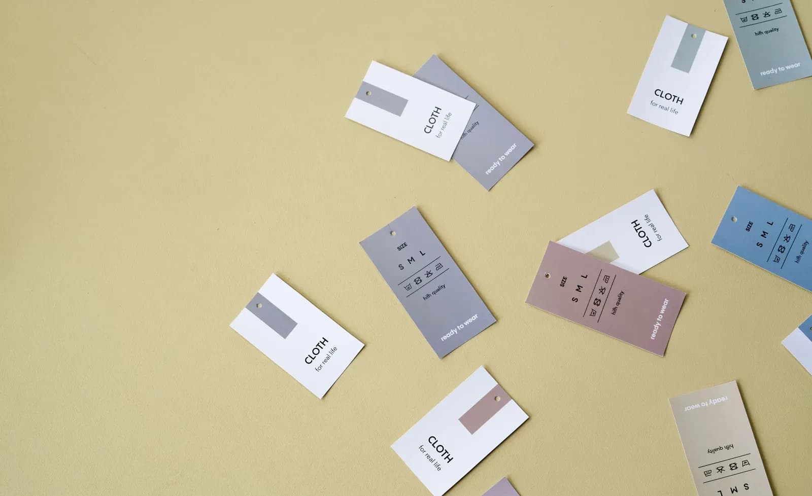 Assorted clothing tags showing that product quantities must be defined by a specific configuration