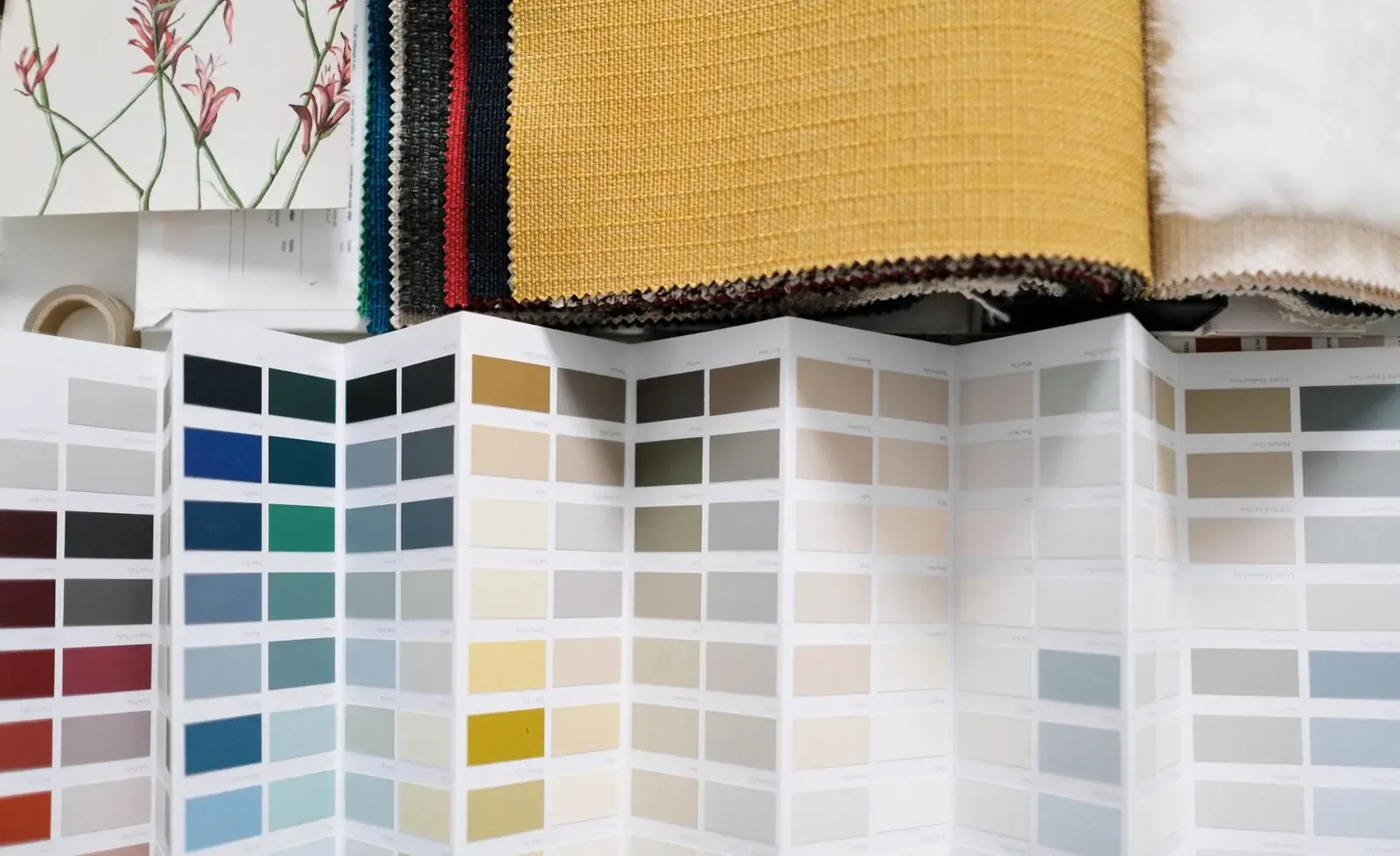 Fabric swatches and a color palette used to plan several garment colorways
