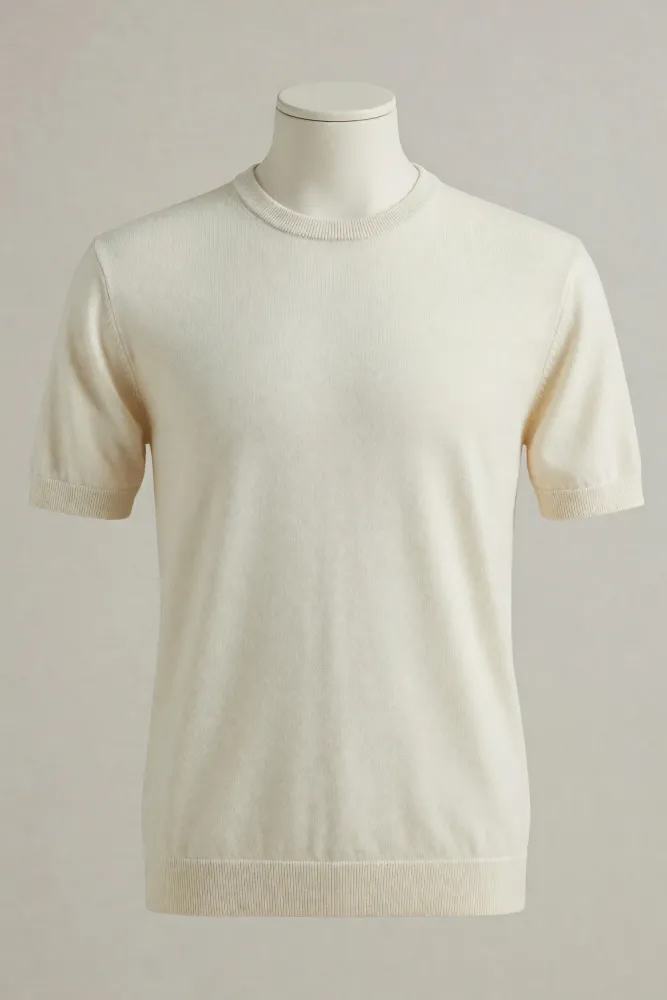 Ivory short-sleeve crew-neck knit T-shirt with a broad ribbed hem and finished neck and cuffs shown on a faceless mannequin for private-label sourcing