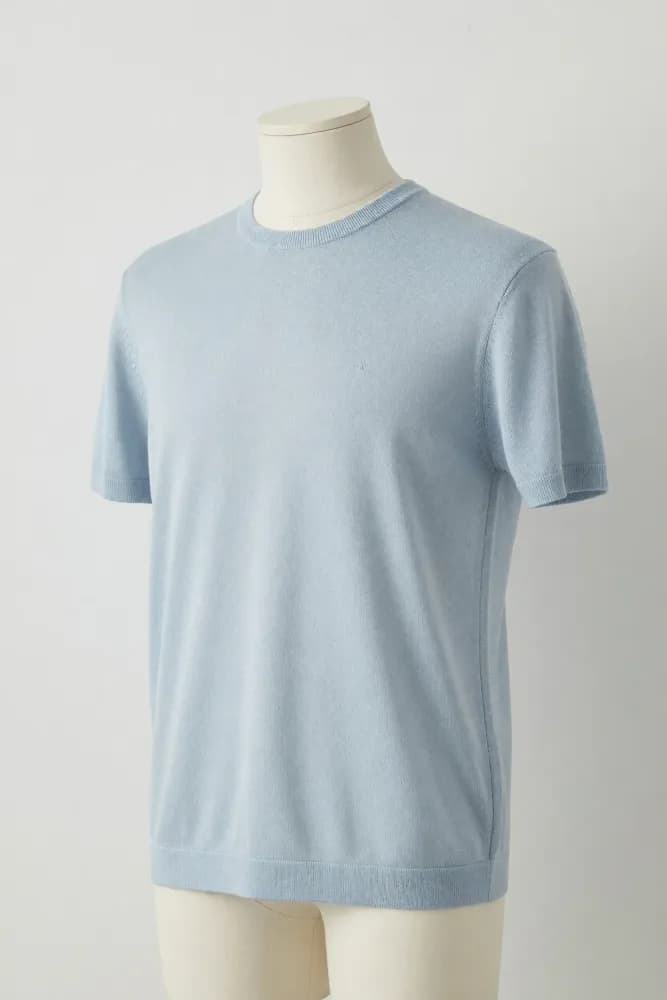 Sky blue narrow-rib crewneck knit tee displayed on a torso mannequin for private-label knitwear development