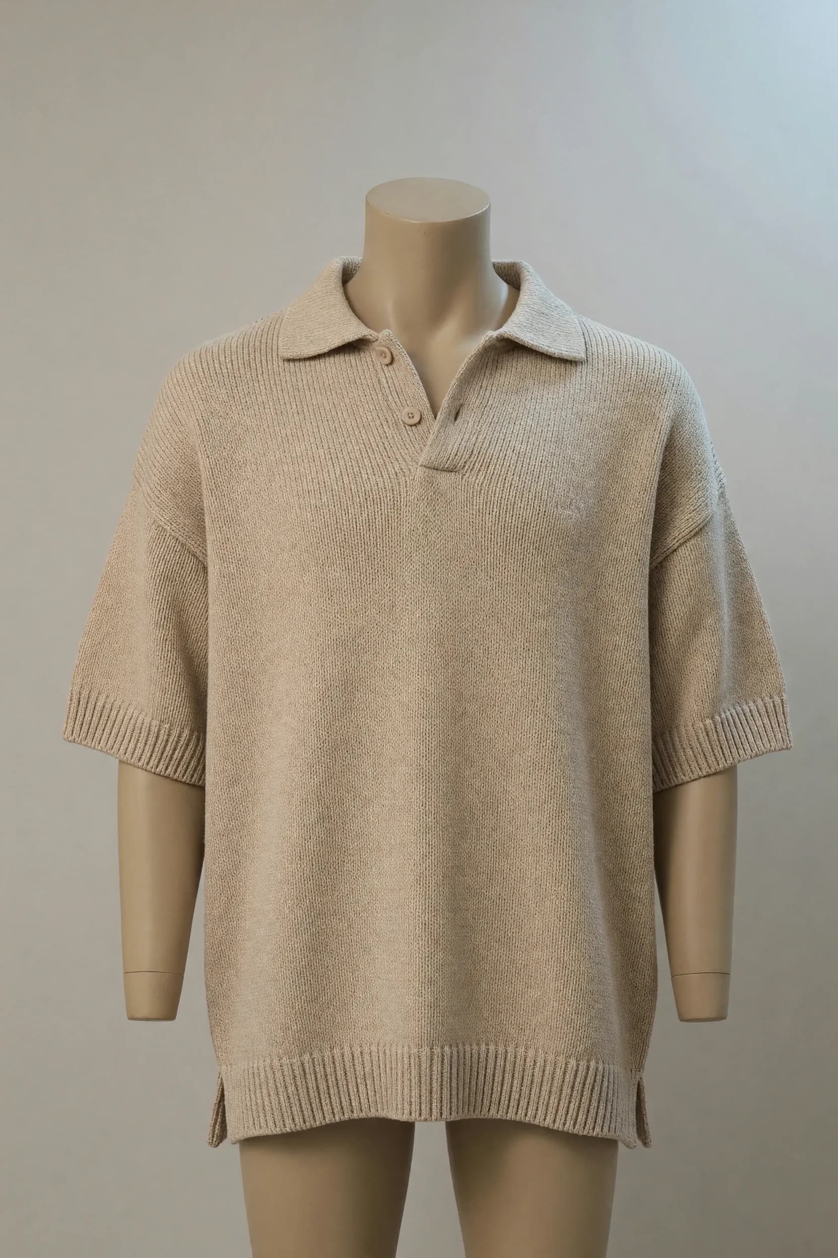 Sand relaxed open-collar short-sleeve knit polo presented on a torso mannequin for private-label collection development