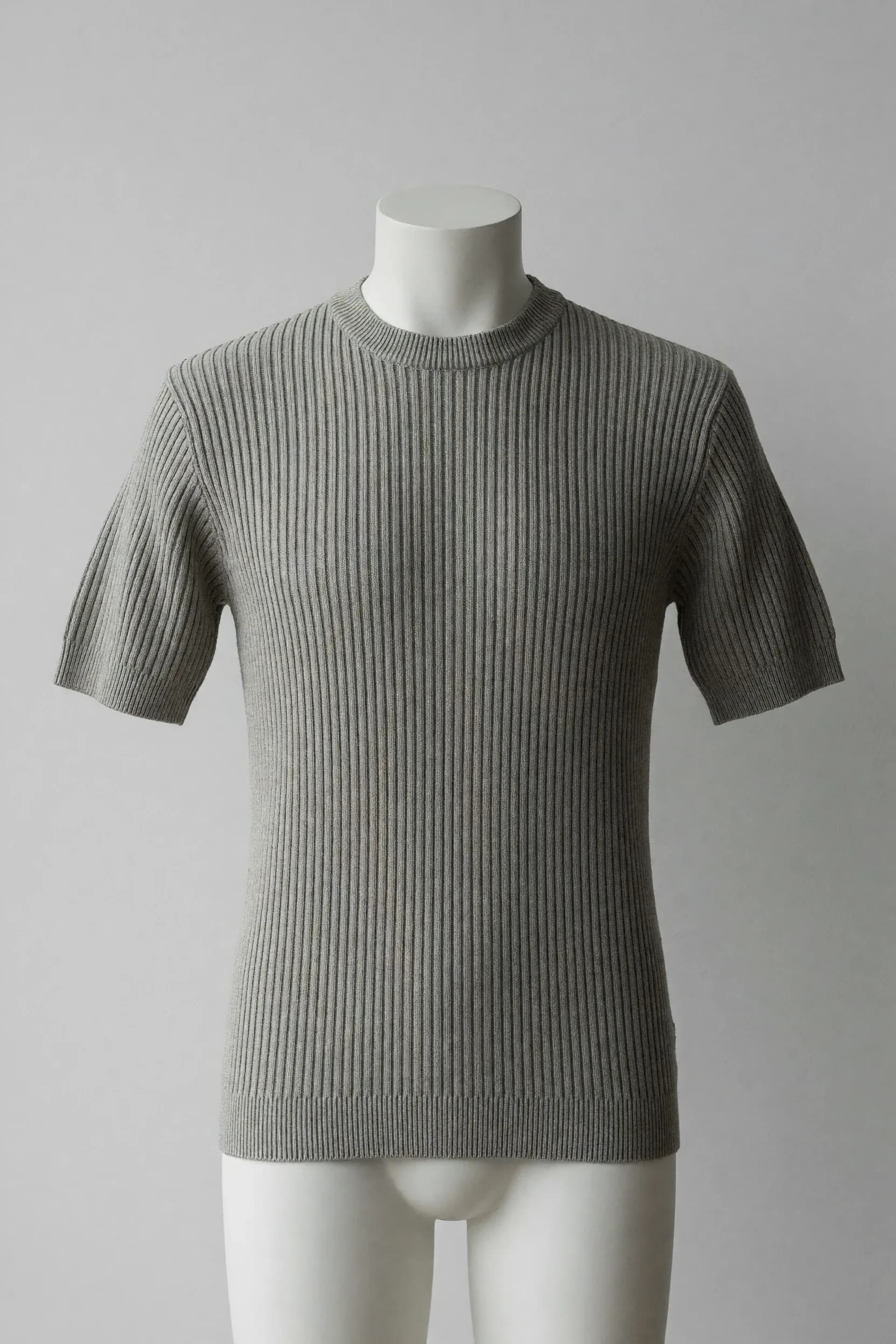 Light silver-grey vertical-rib crewneck short-sleeve knit tee on a mannequin for private-label product development